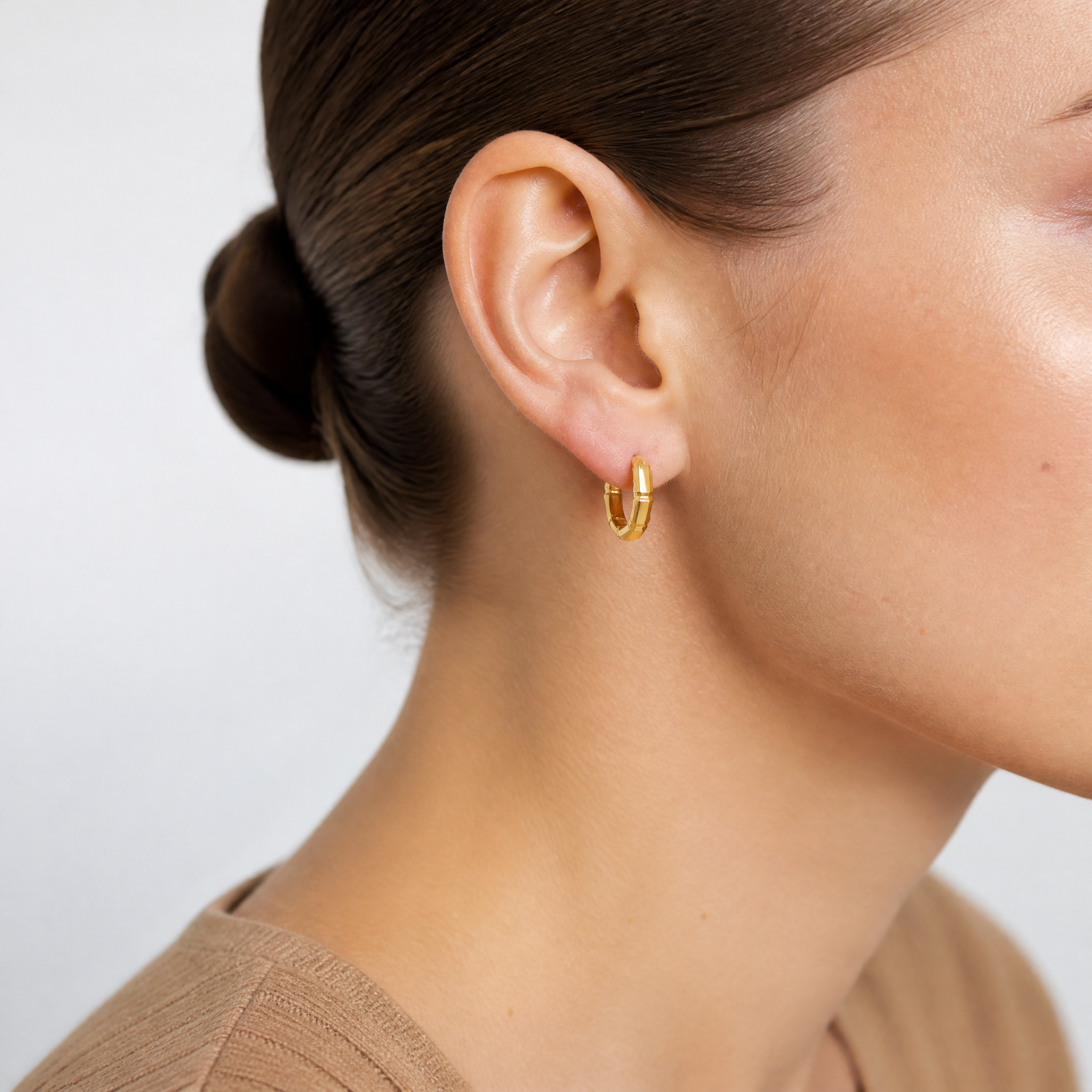 Leslie's 14K Polished and Diamond-cut Huggie Hoop Earrings - Model Shot