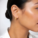 Leslie's 14K Polished and Diamond-cut Huggie Hoop Earrings - Model Shot