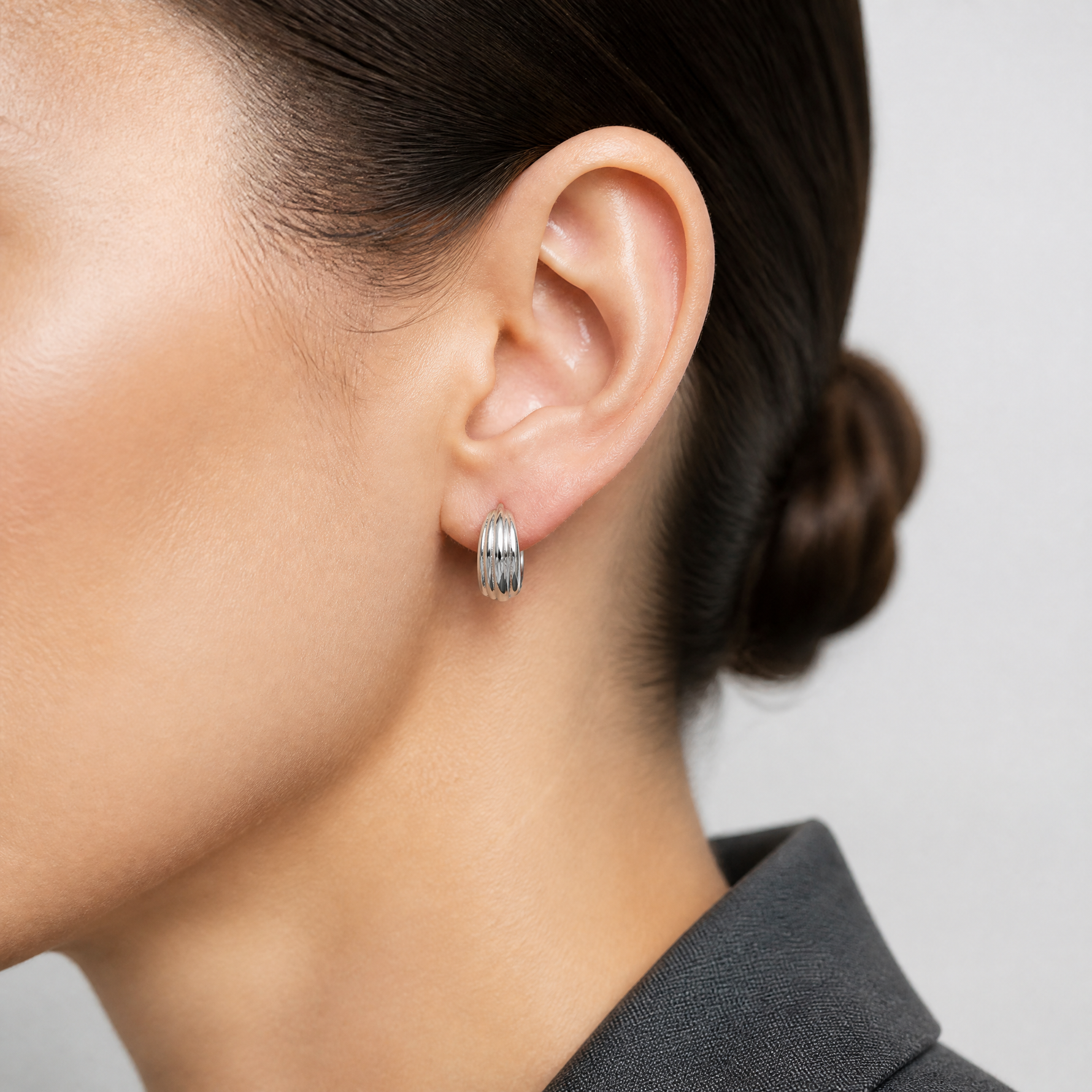 Leslie's 14K WG Polished/Grooved Round Huggie Hoop Earrings - Model Shot