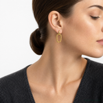 Leslie's 14K Polished and Twisted Oval Link Dangle Post Earrings - Model Shot