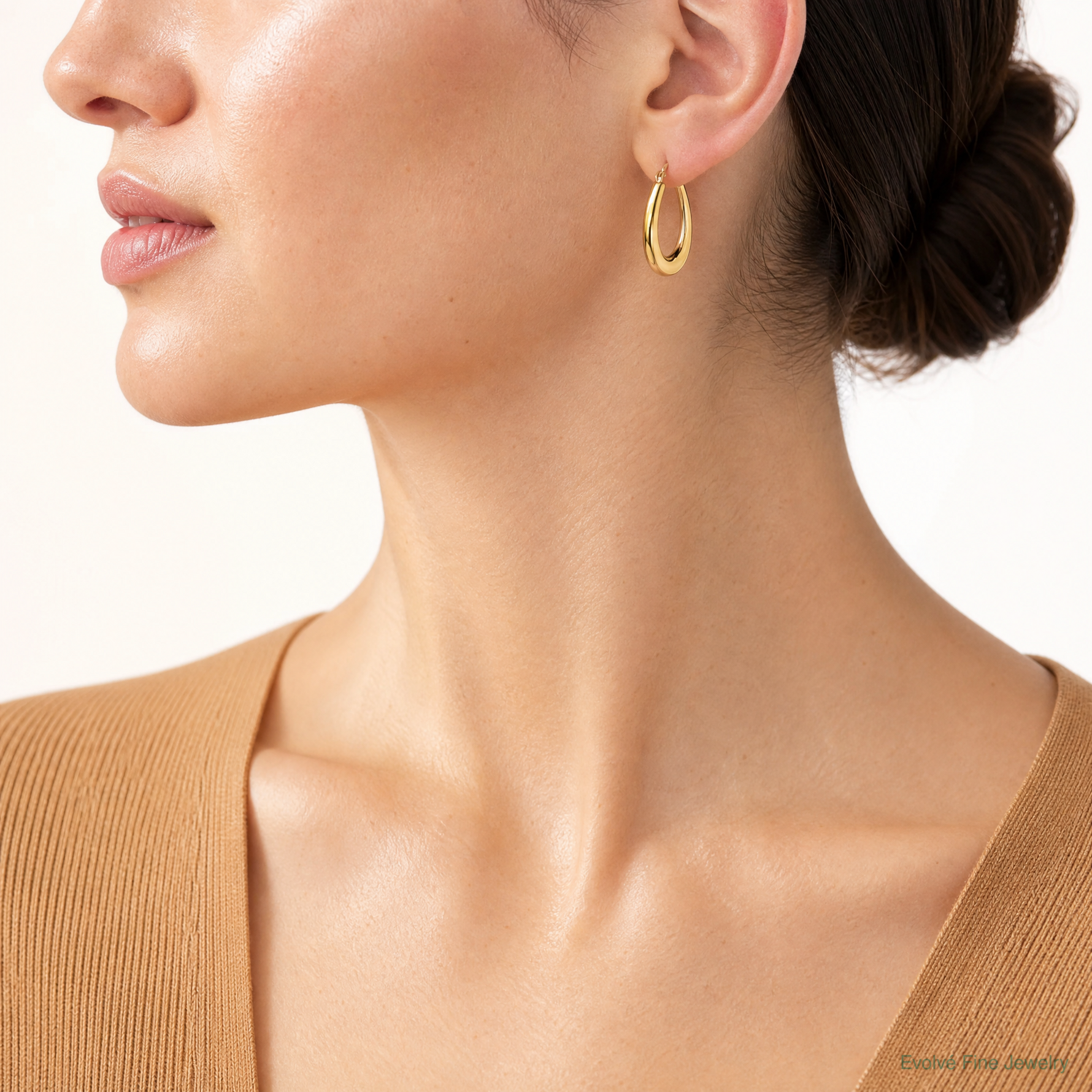 Leslie's 14K Polished Oval Hollow Hoop Earrings - Model Shot