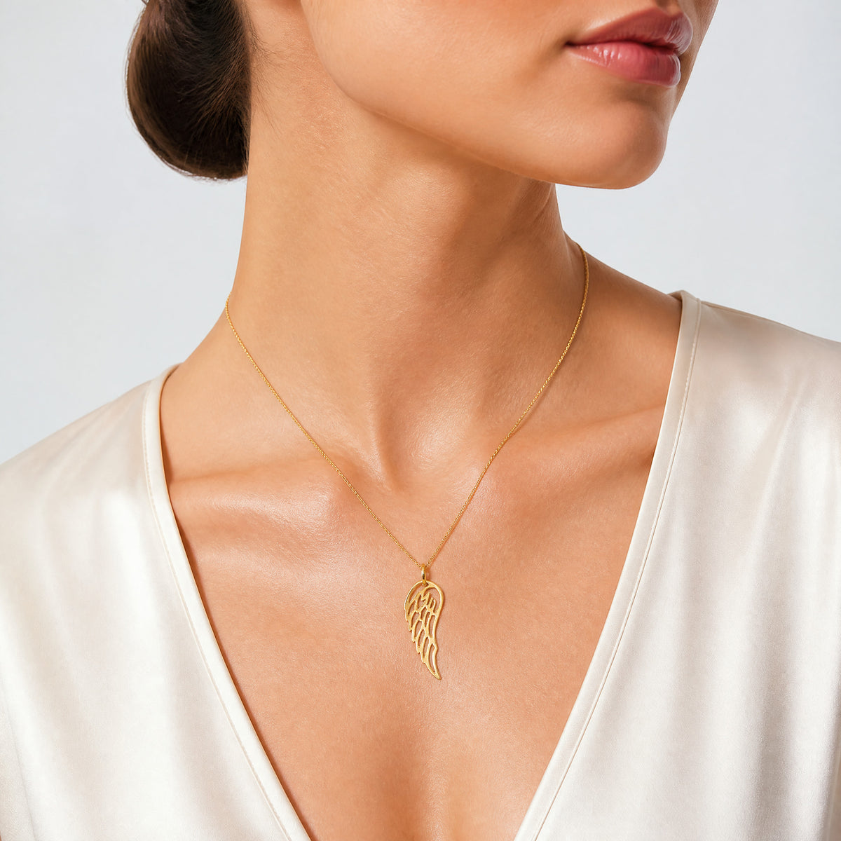 Sterling Silver Gold-tone Polished Angel Wing Charm - Model Shot