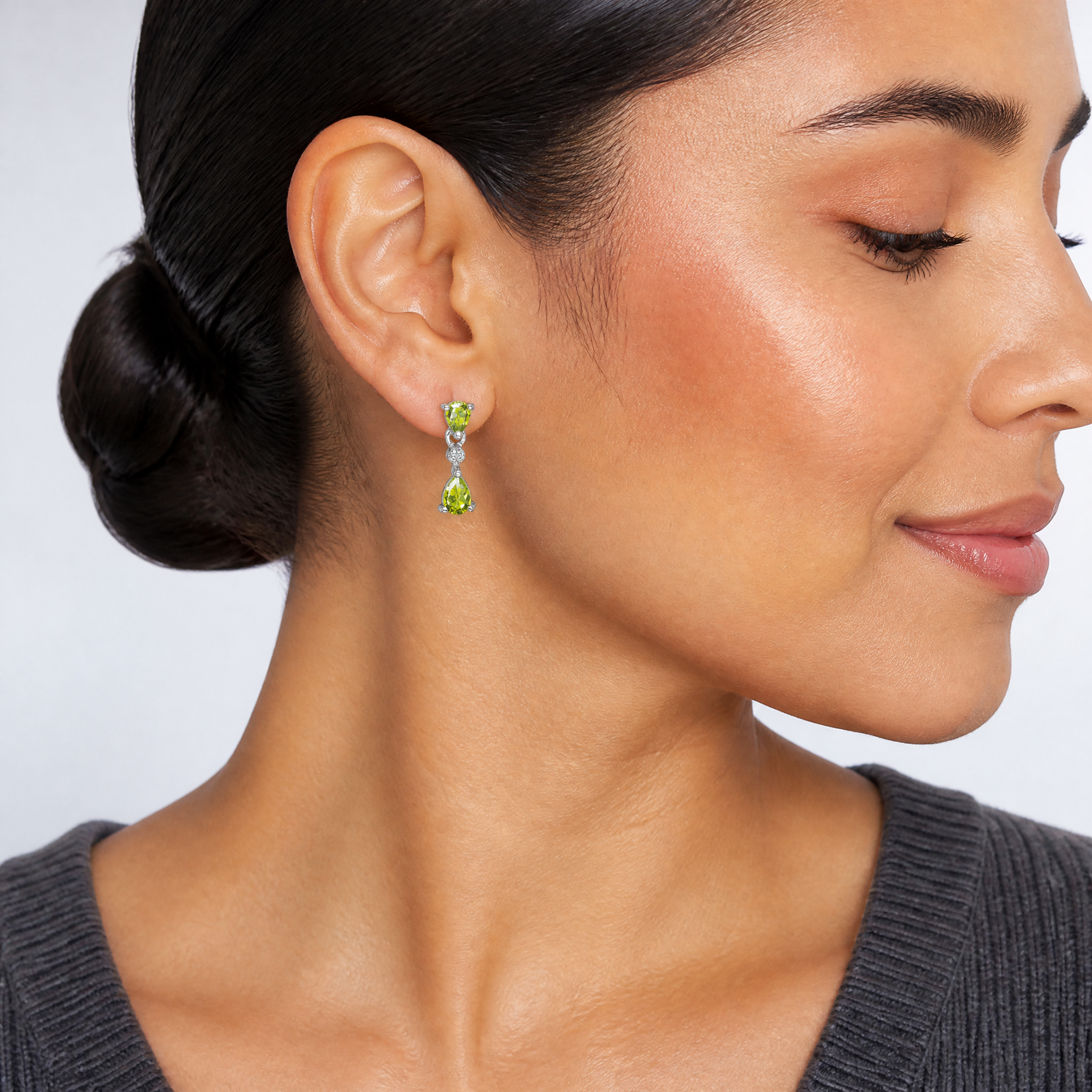 Sterling Silver Rhodium Plated Pear Peridot and Diamond Post Earrings - Model Shot