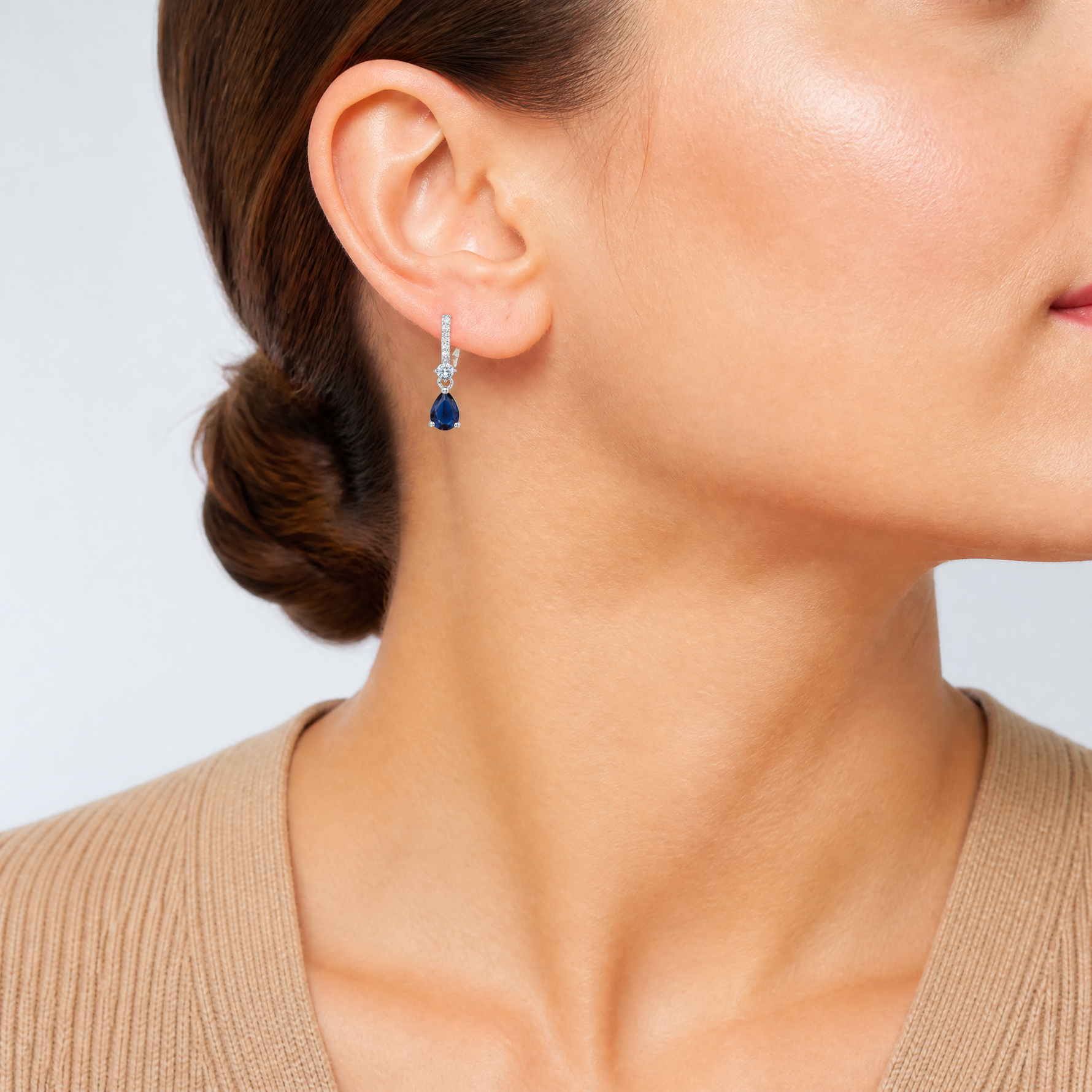 Sterling Silver Rhodium-plated CZ and Blue Glass Post Dangle Earrings - Model Shot