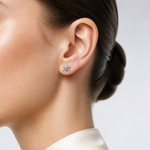 Sterling Silver Rhodium-plated Antiqued Skull and Crossbones Post Earrings - Model Shot