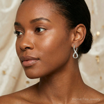 Sterling Silver Polished & Twisted Oval Hoop Earrings - Model Shot