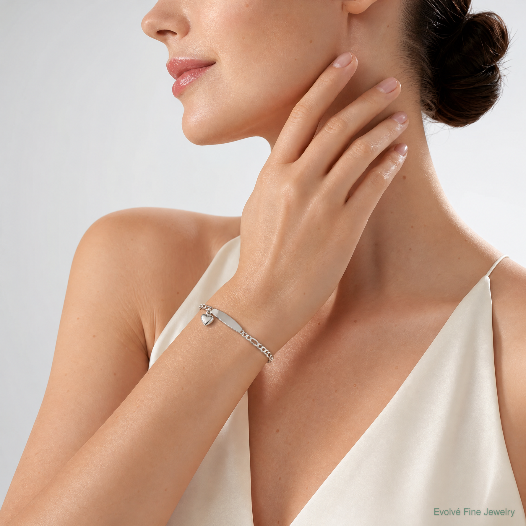 Sterling Silver Polished Figaro ID Heart Dangle Bracelet - Model Shot