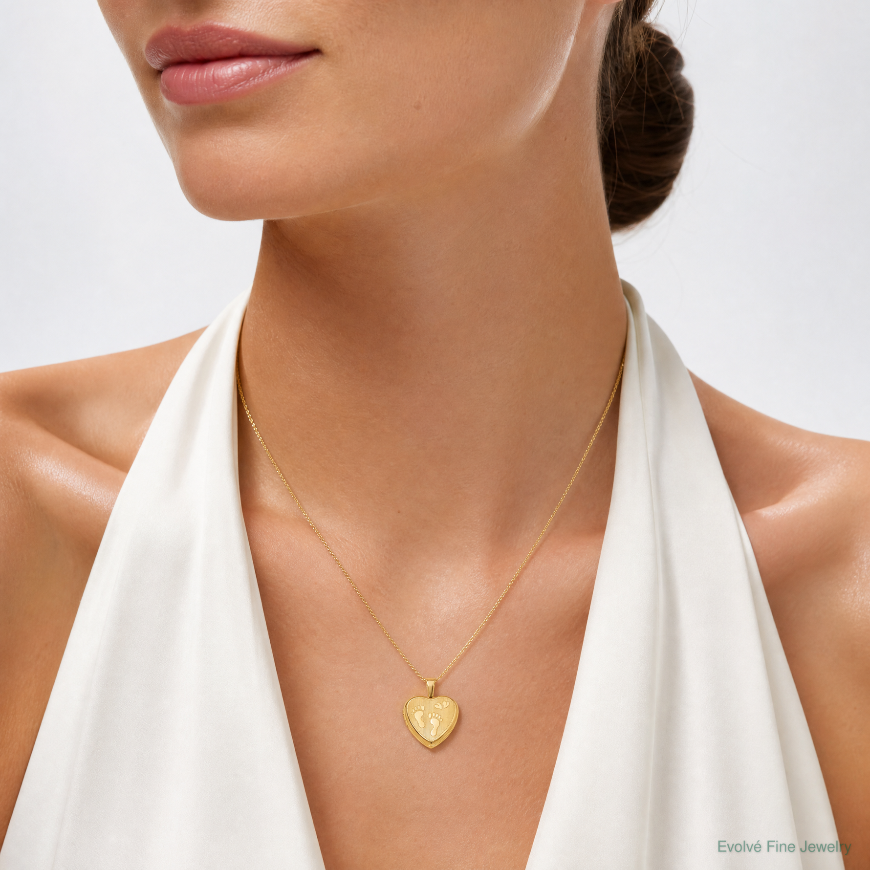 SS Gold-plated Brushed And Polished Footprints 12mm Heart Locket - Model Shot