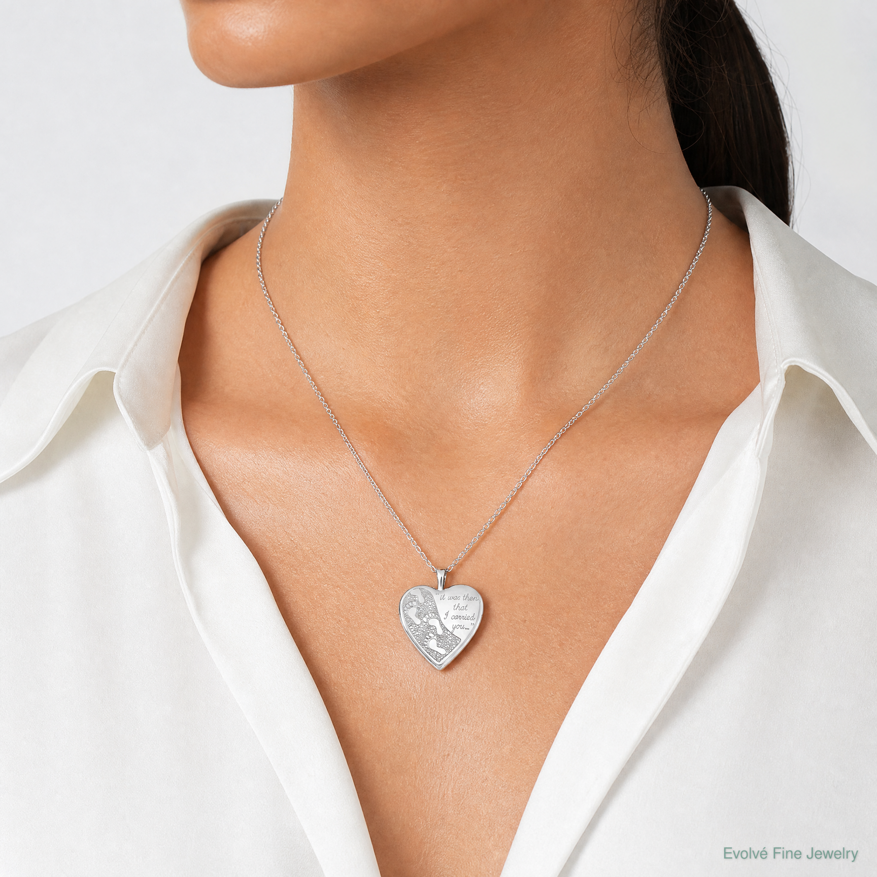 Sterling Silver Rhodium-plated 20mm Footprints Heart Locket - Model Shot