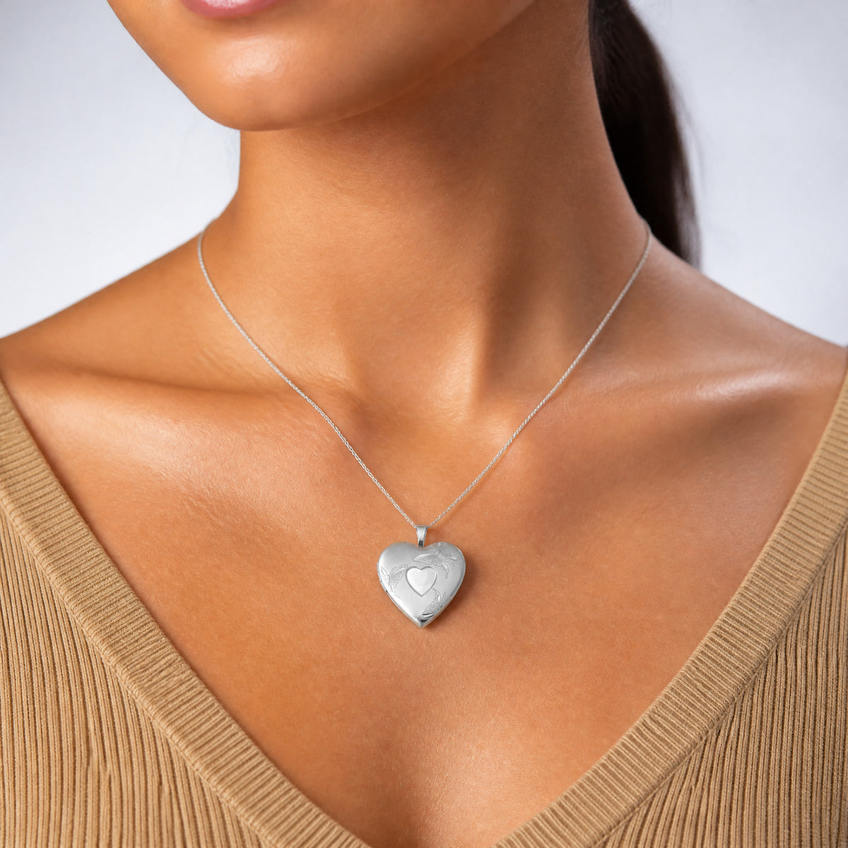 Sterling Silver Rhod-plated 20mm Satin/Polished D/C Butterfly Heart Locket - Model Shot
