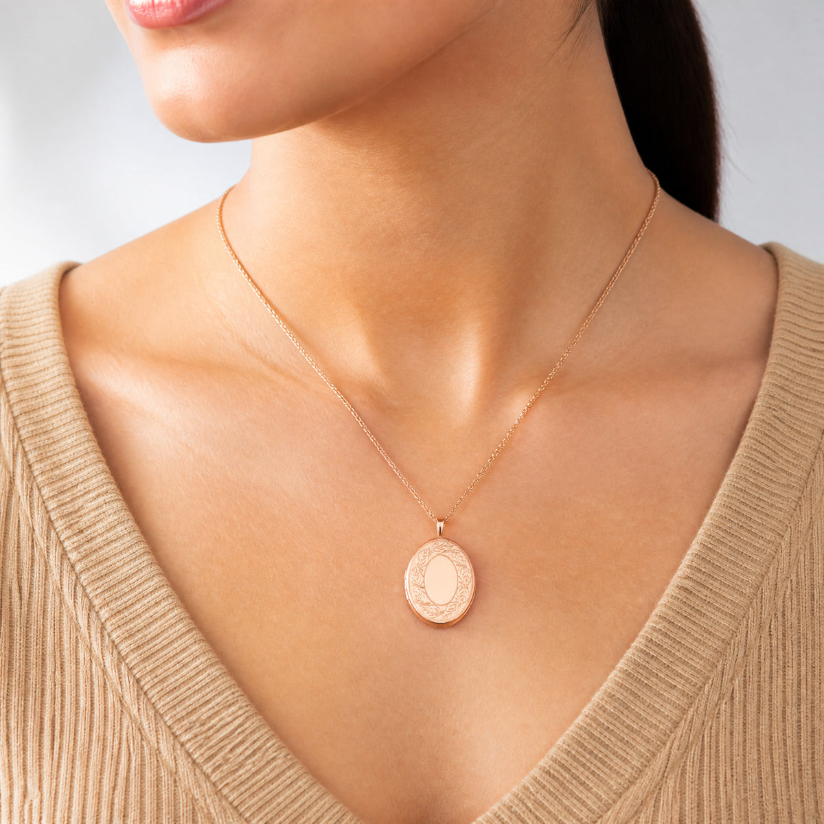 Sterling Silver Rose Gold-plated 26mm Leaf Border Oval Locket - Model Shot