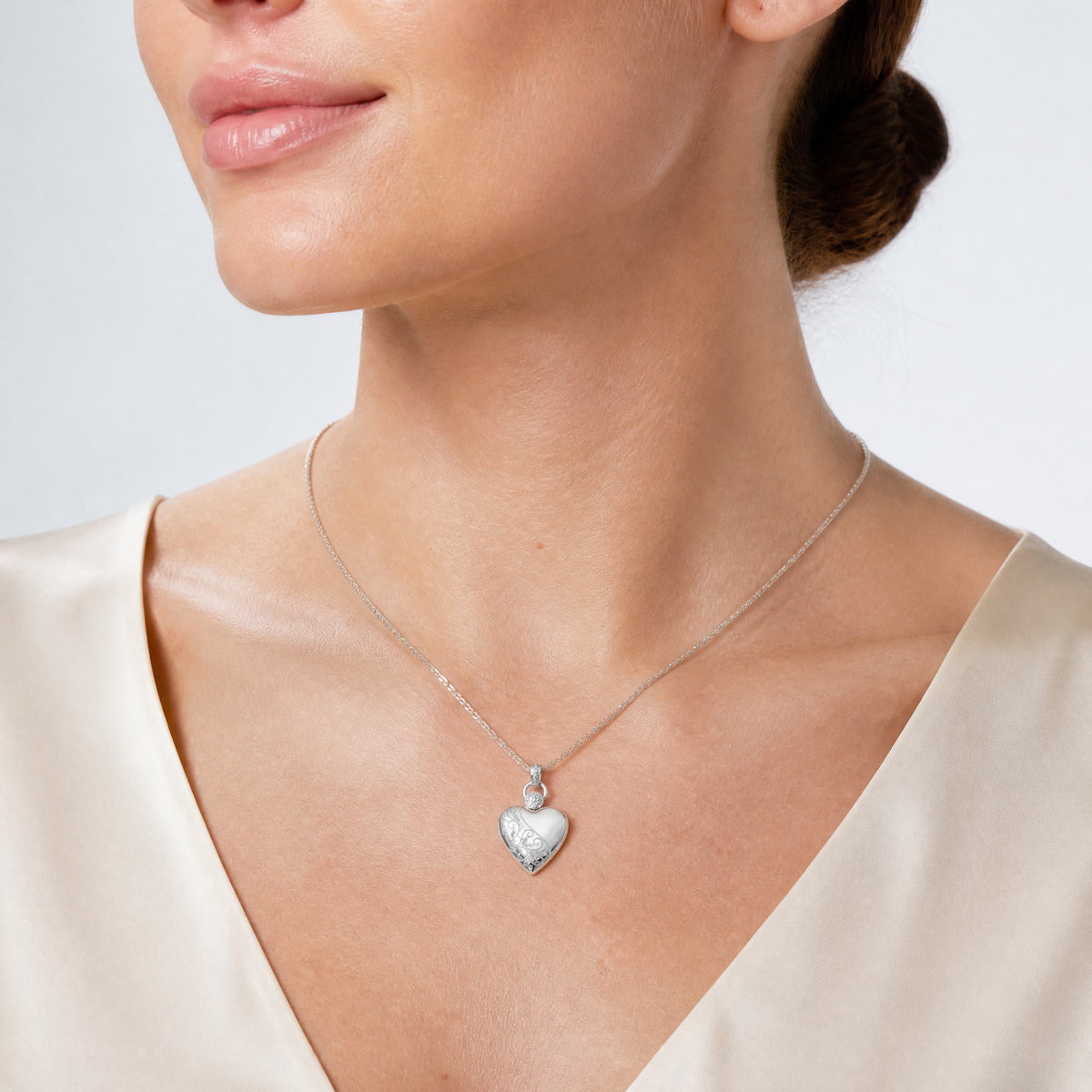 Sterling Silver Rhodium-plated 21mm Heart Dia. Accent D/C Satin Locket - Model Shot