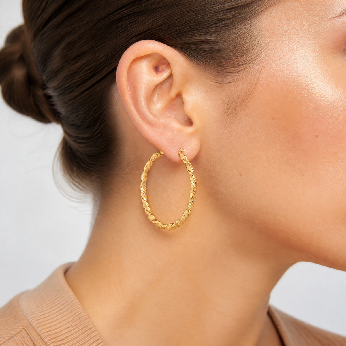 14K Polished and Textured Twisted Hoop Earrings - Model Shot