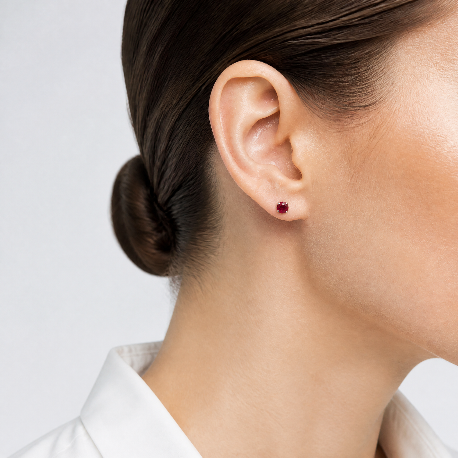 14k White Gold 4mm Ruby Stud Earrings - Model Shot