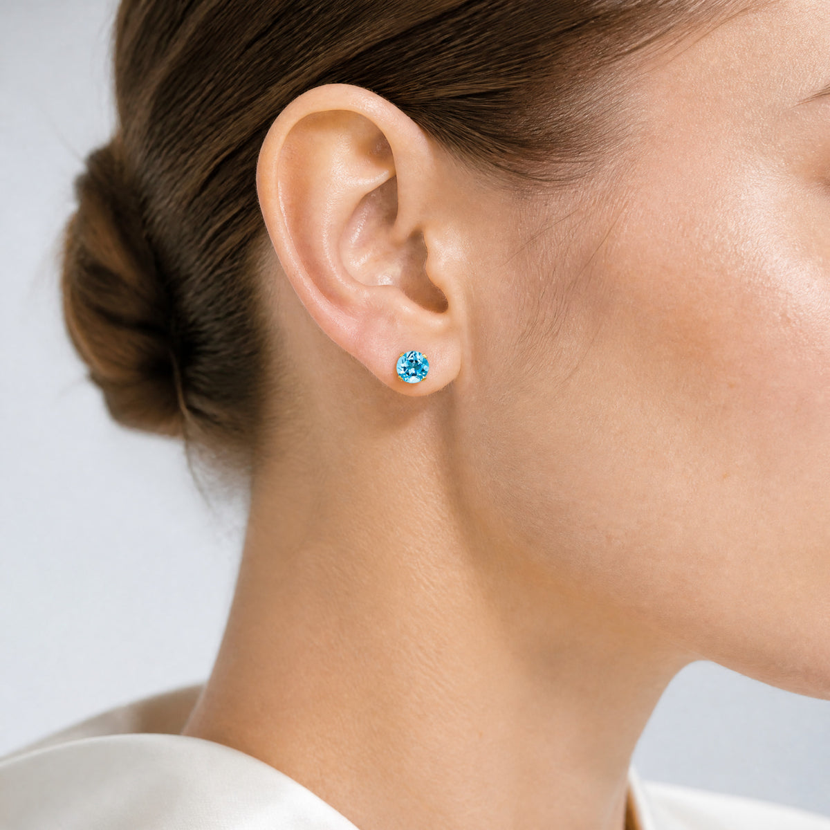 14k 5mm Blue Topaz Earrings - December - Model Shot