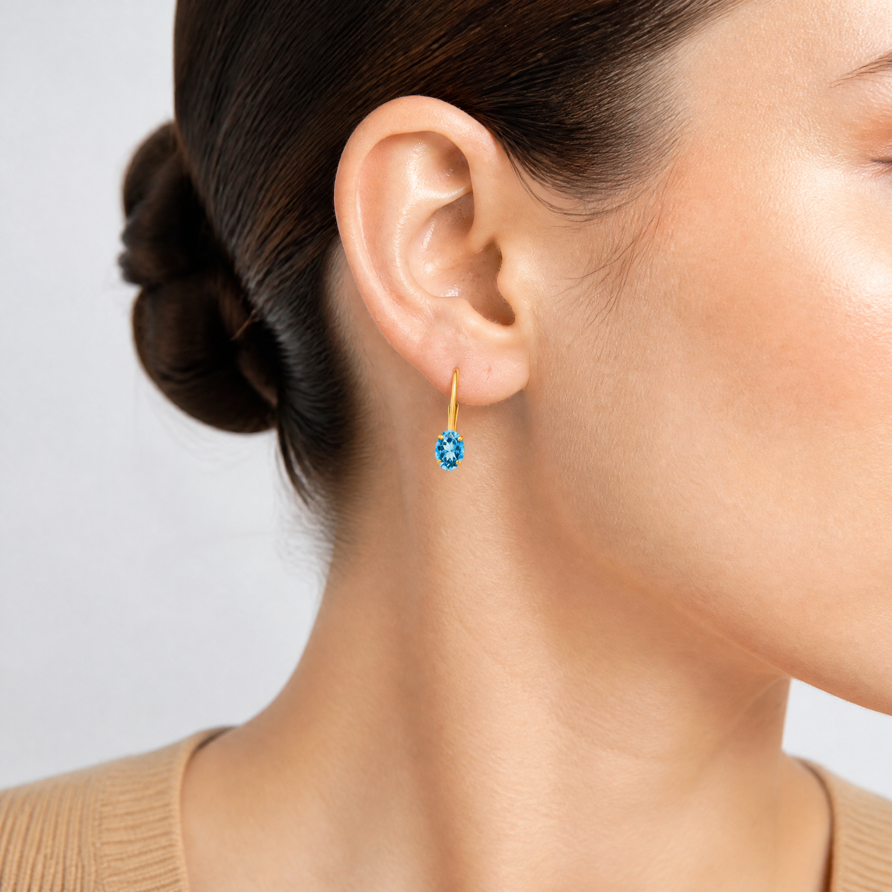 14k 6x4mm Oval Blue Topaz Leverback Earrings - Model Shot