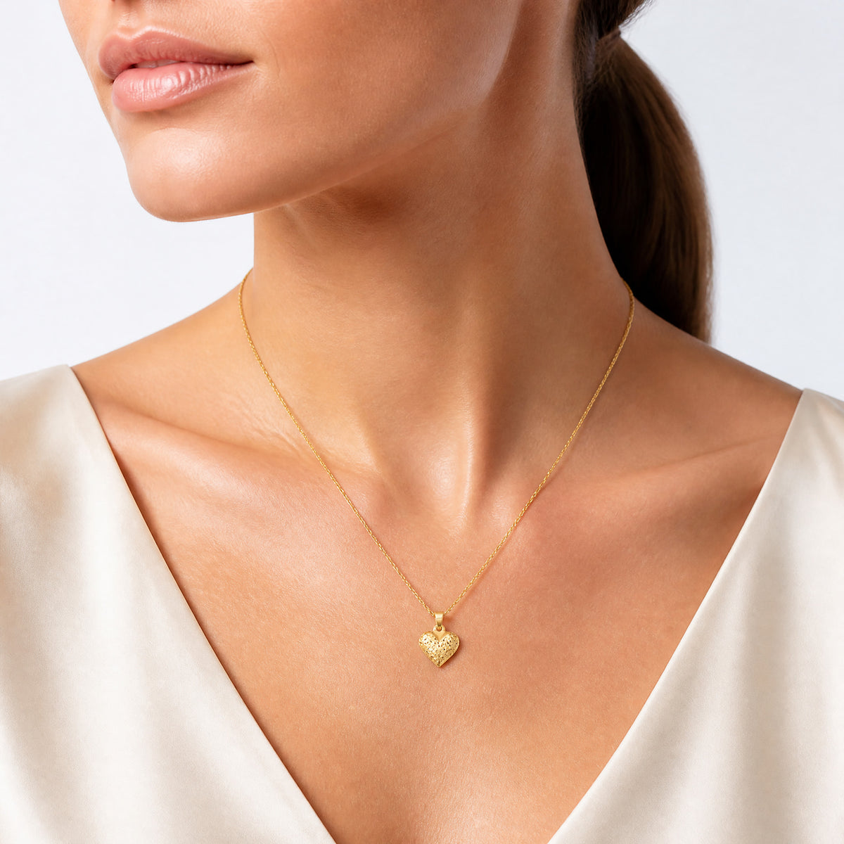 14k Polished Diamond-cut Medium Puffed Heart Pendant - Model Shot