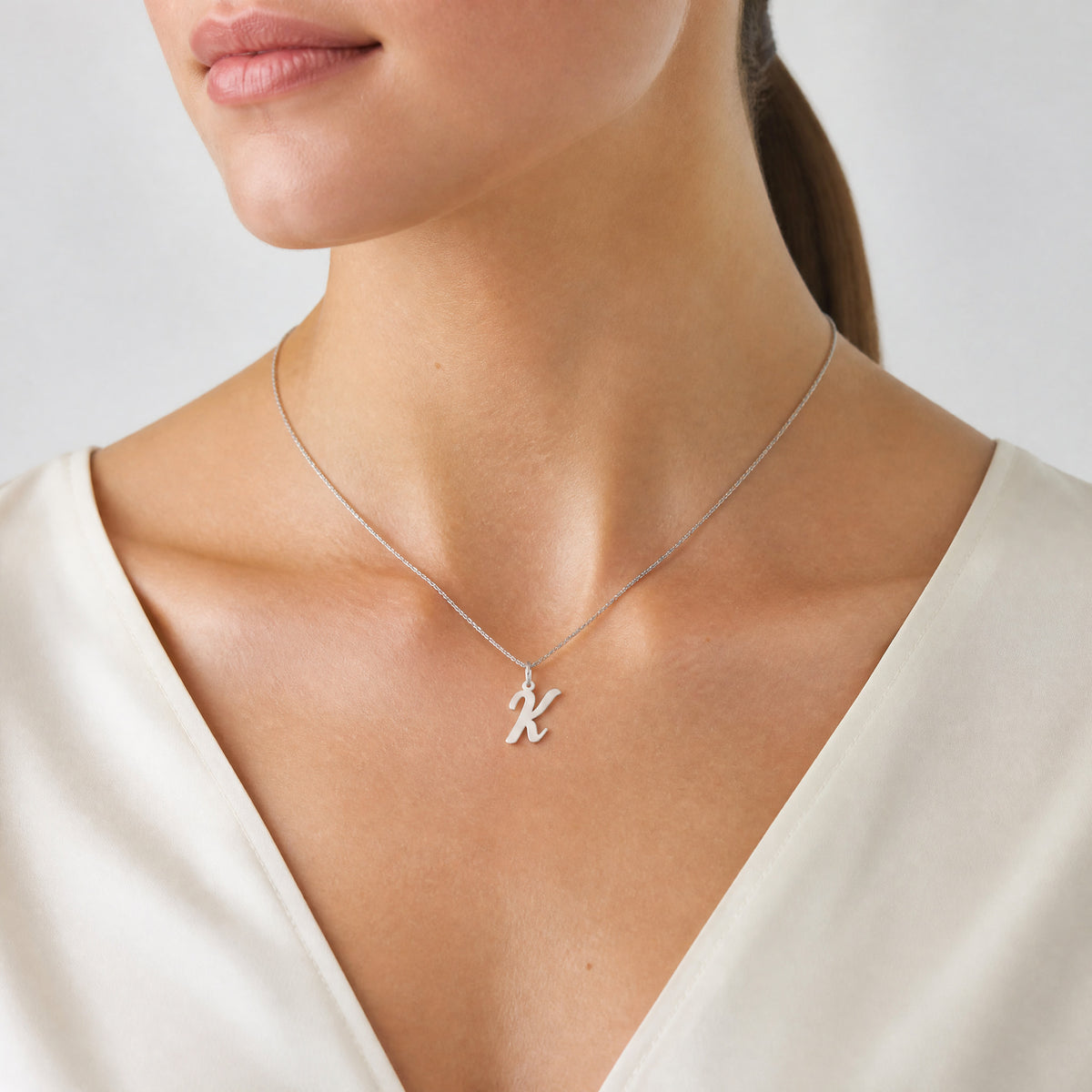 14k White Gold Medium Script Letter K Initial Charm - Model Shot