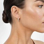 14k Polished CZ 4x14mm Huggie Hoop Earrings - Model Shot