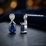 Sterling Silver Rhodium Plated Diamond & Sapphire Oval Post Earrings - Close-up View