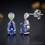 Sterling Silver Rhodium Plated Diamond & Tanzanite Oval Post Earrings - Close-up View