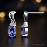 Sterling Silver Rhodium Plated Diamond & Tanzanite Oval Post Earrings - Close-up View