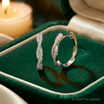 Sterling Silver Rhodium-plated CZ Twisted Oval Hoop Earrings - Lifestyle View