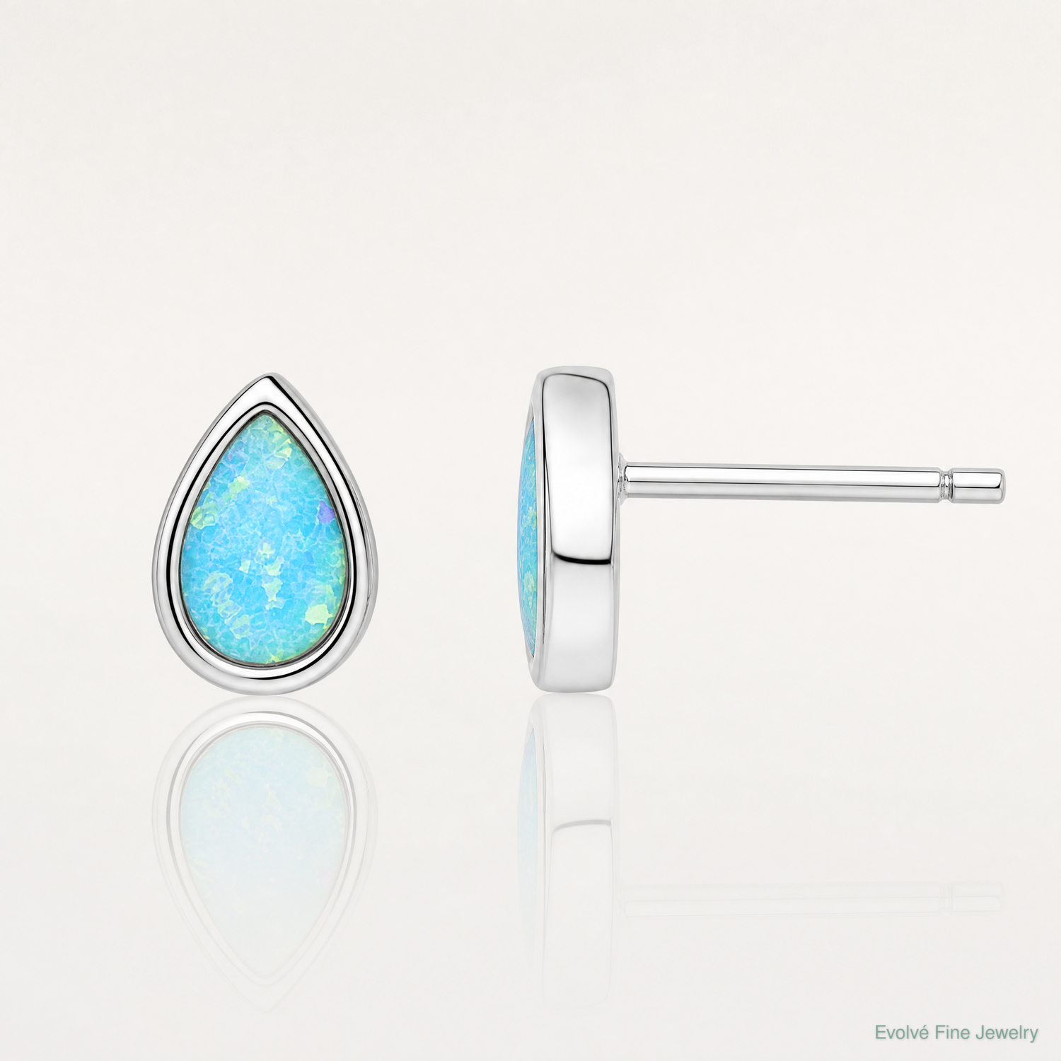 Sterling Silver RH-pltd Polished Blue Created Opal Teardrop Stud Earrings - Lifestyle View