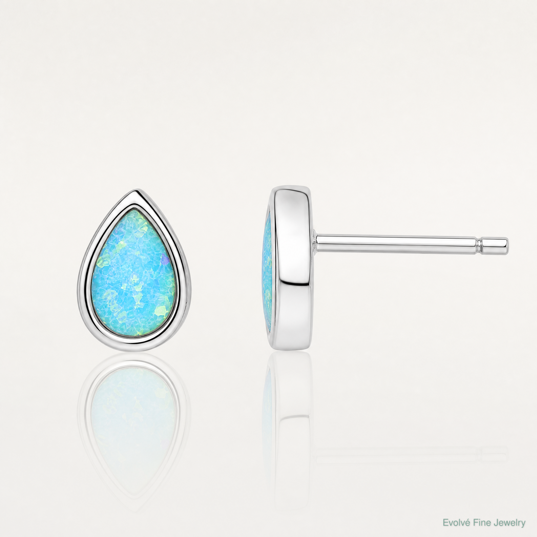 Sterling Silver RH-pltd Polished Blue Created Opal Teardrop Stud Earrings - Lifestyle View