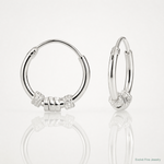 Sterling Silver Polished Beaded Circle Endless Hoop Earrings - Lifestyle View