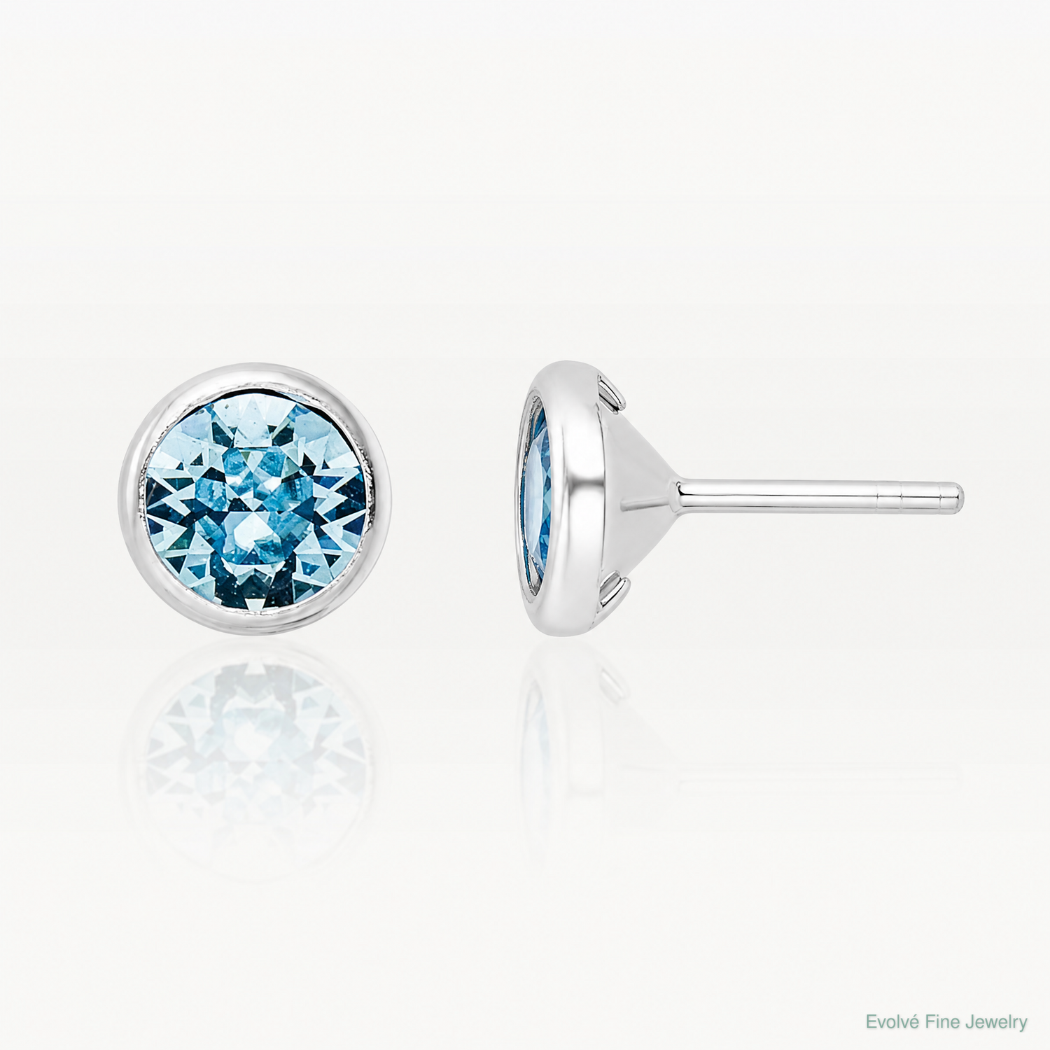Sterling Silver Rhodium-plated Polished Blue Crystal Bezel Stud Earrings - Lifestyle View