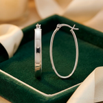 Sterling Silver Rhodium-plated Beveled Edge 4mm Oval Hoop Earrings - Lifestyle View