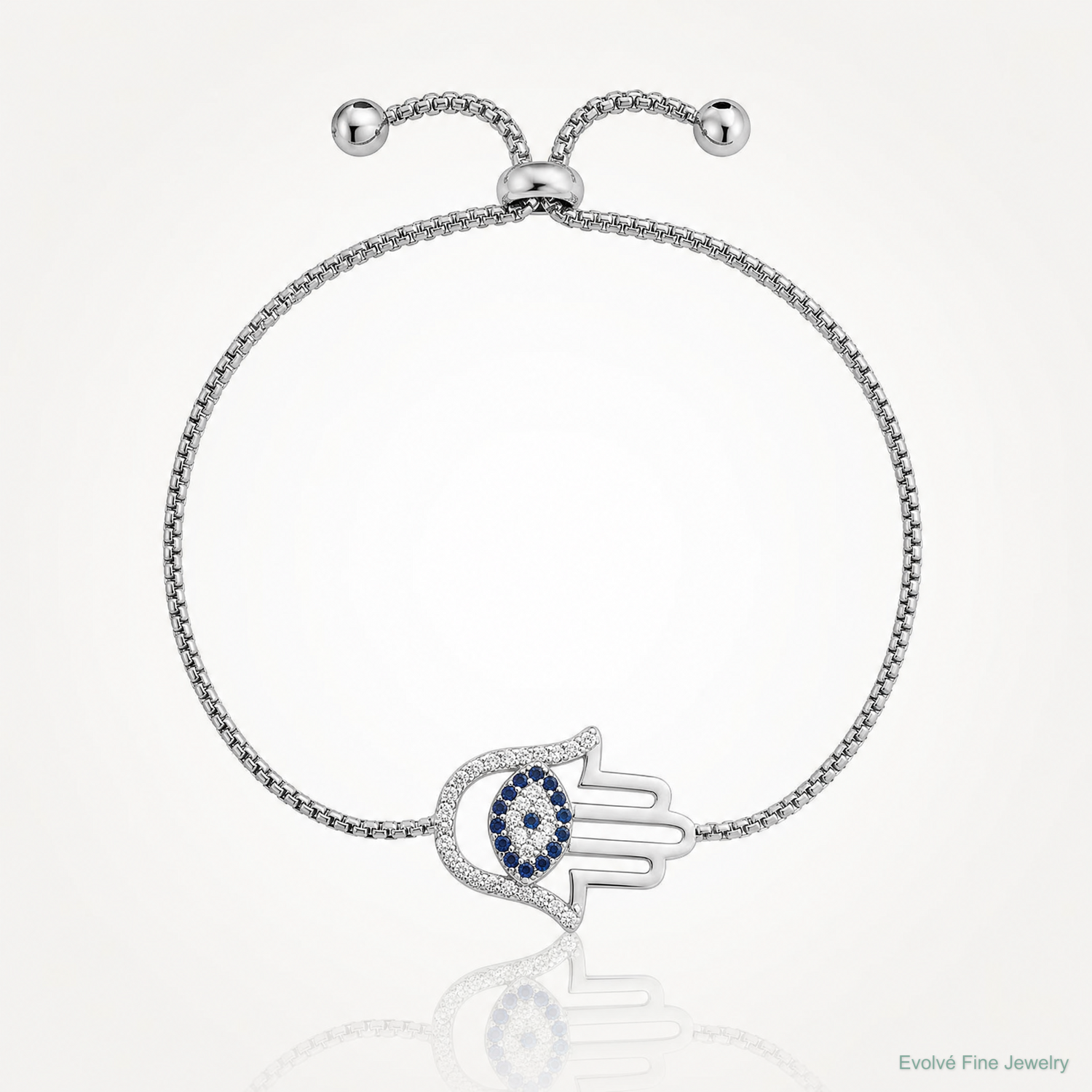 SS RH-pltd Polished CZ and Cr. Blue Spinel Evil Eye Hamsa Adj Bolo Bracelet - Lifestyle View