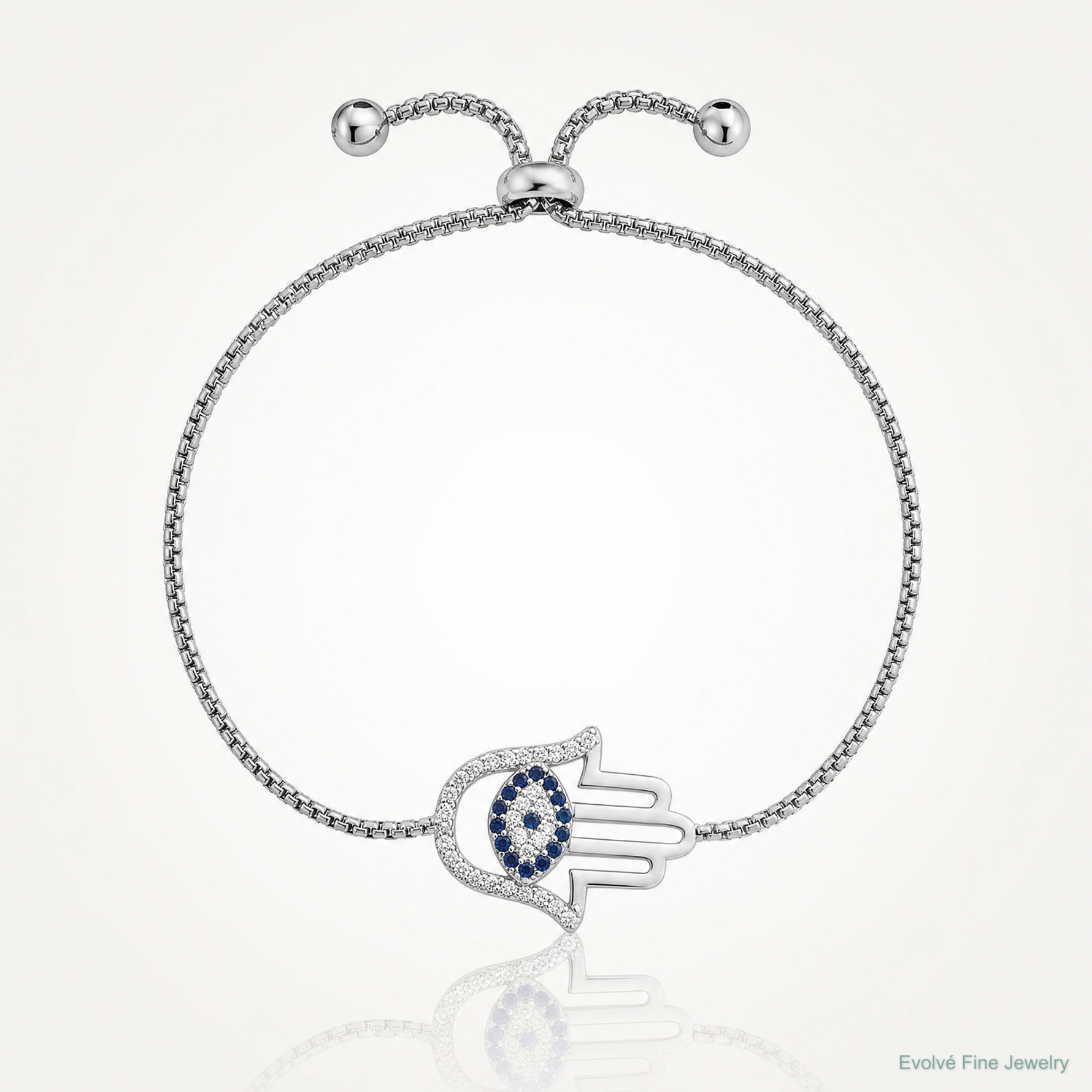 SS RH-pltd Polished CZ and Cr. Blue Spinel Evil Eye Hamsa Adj Bolo Bracelet - Lifestyle View