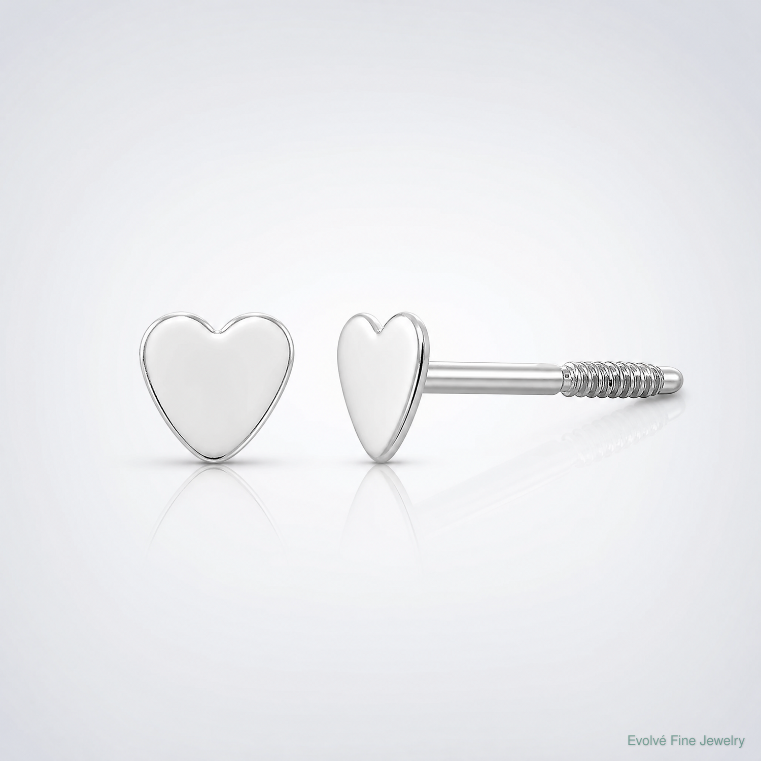 14k White Gold Madi K Tiny Heart Baby Post Earrings - Lifestyle View