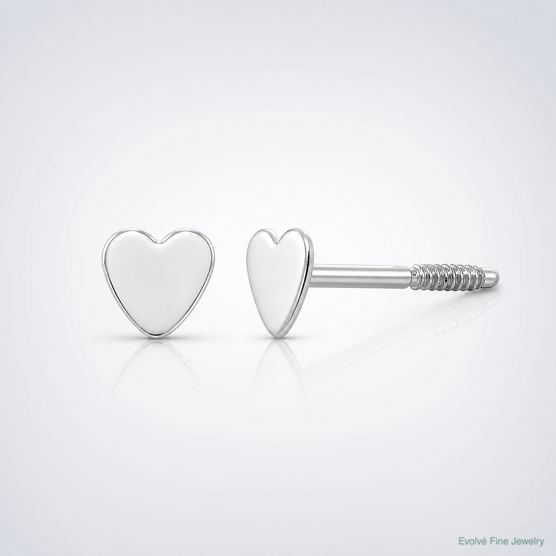14k White Gold Madi K Tiny Heart Baby Post Earrings - Lifestyle View