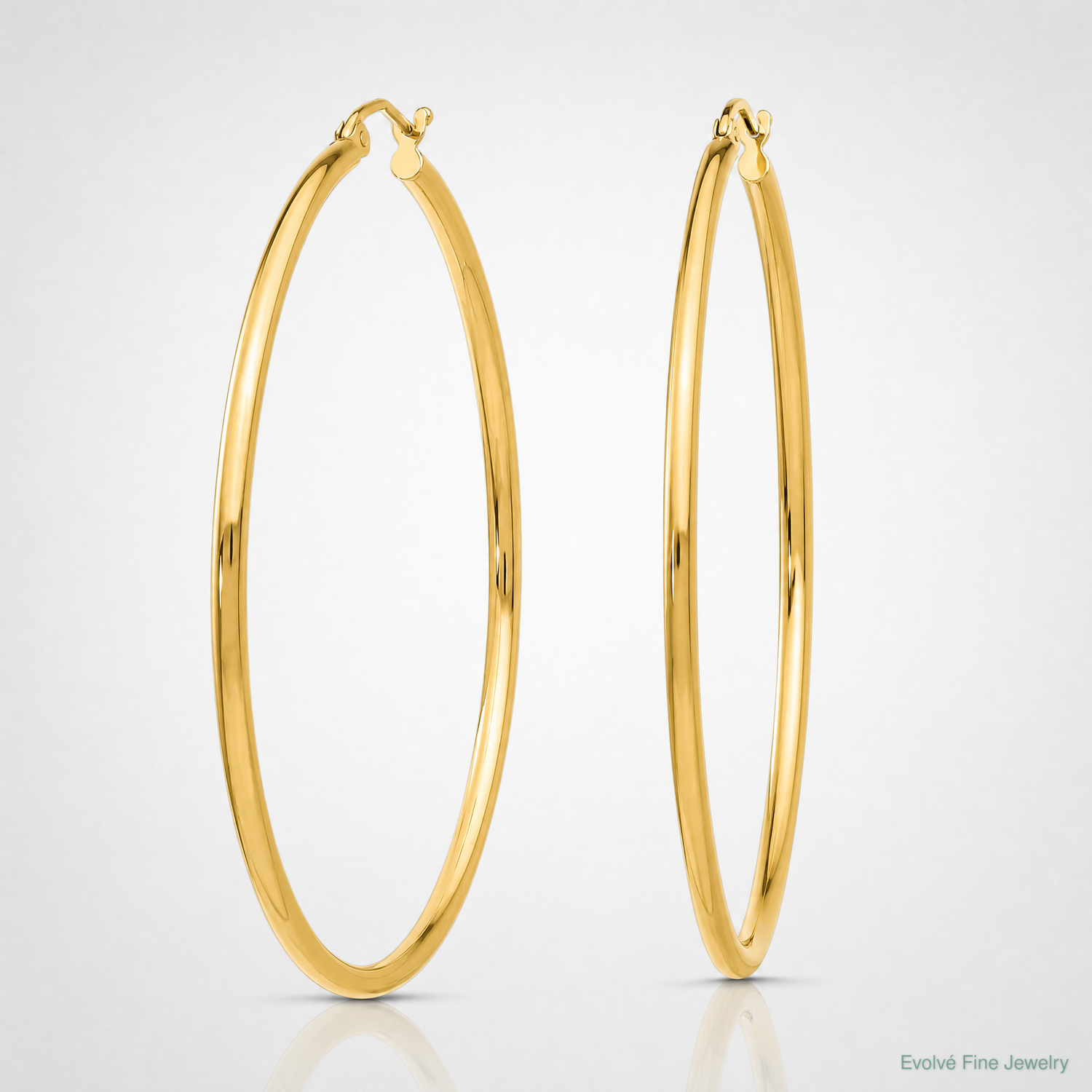14k Polished 2x50mm  Lightweight Tube Hoop Earrings - Lifestyle View