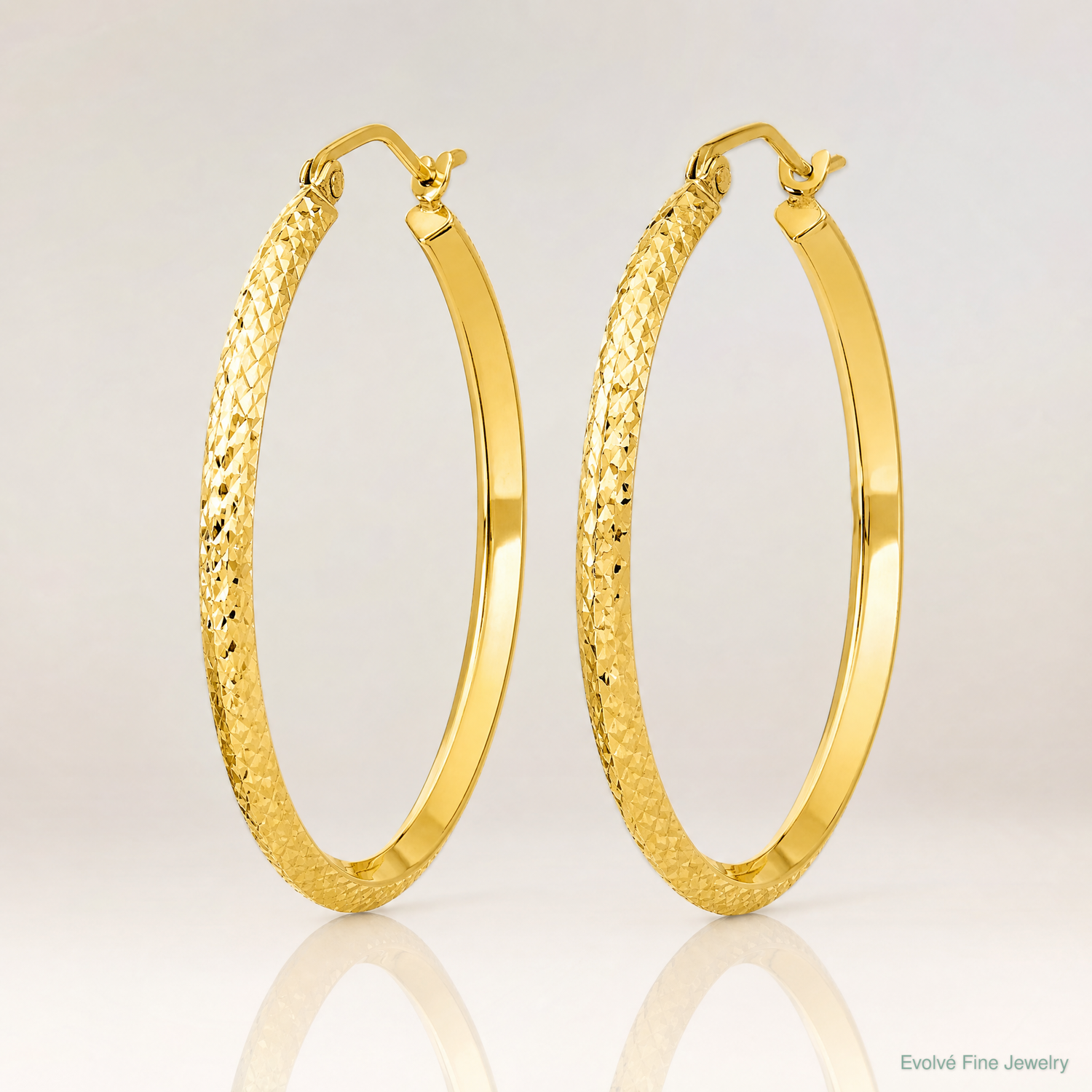 14K Knife Edge Diamond-cut Hollow Hoop Earrings - Lifestyle View