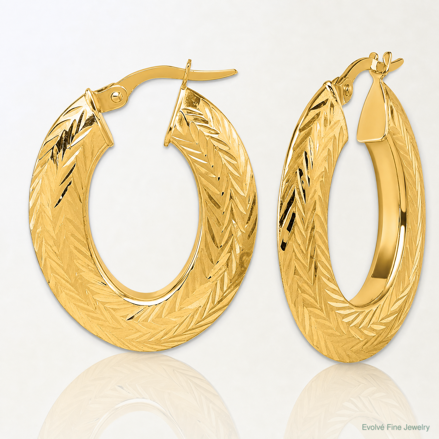 14K Polished and Diamond-cut Oval Hoop Earrings - Lifestyle View