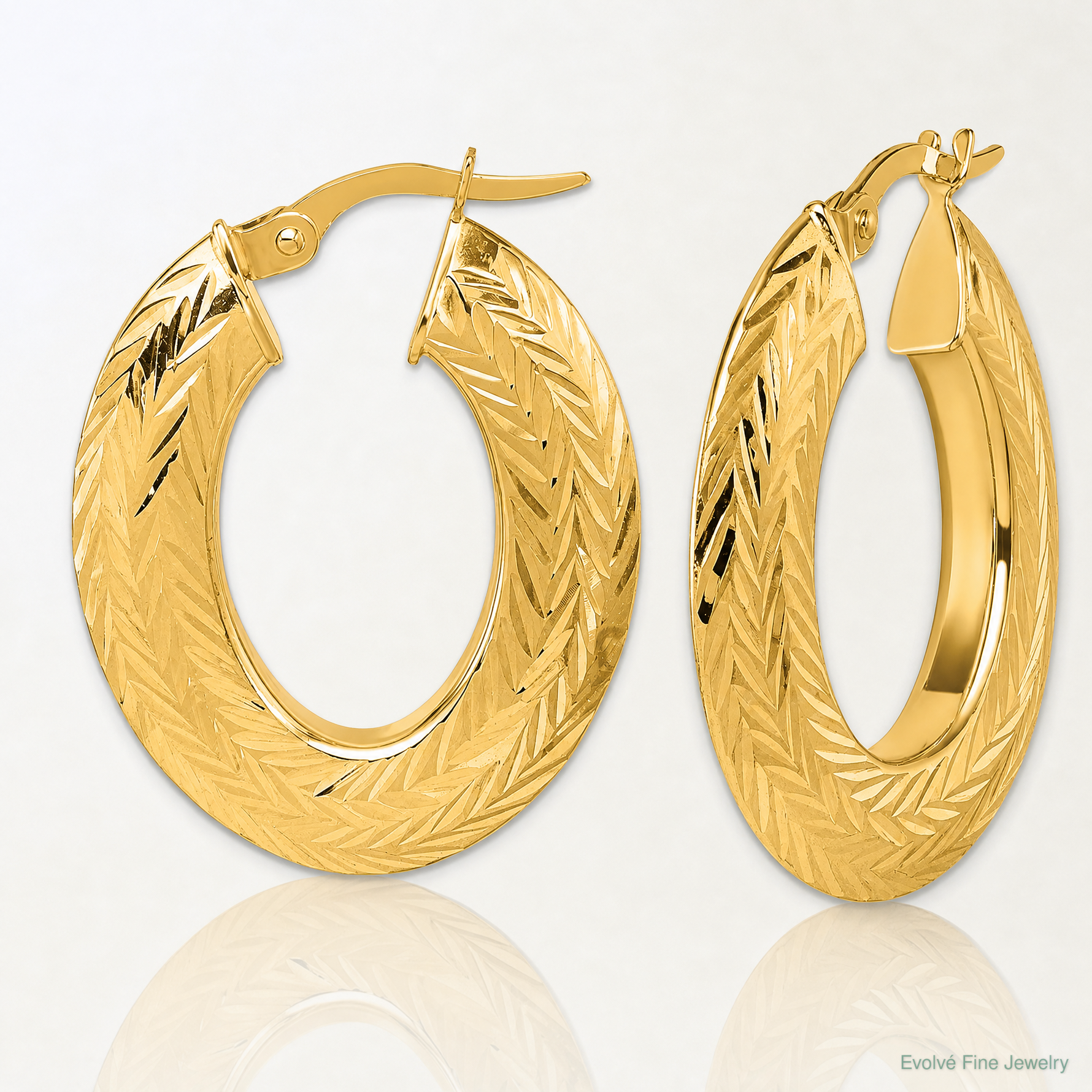 14K Polished and Diamond-cut Oval Hoop Earrings - Lifestyle View