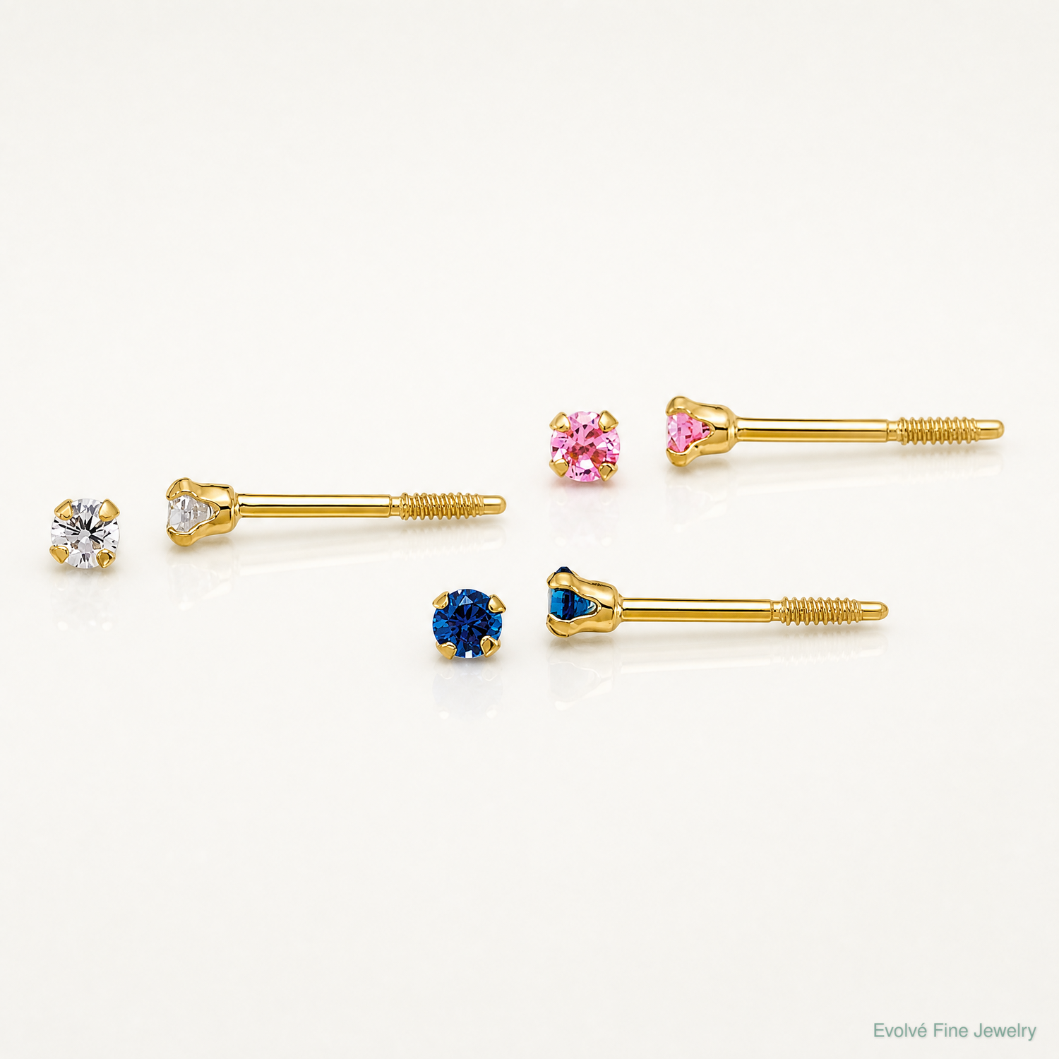 14k Polished 2mm White Pink And Blue CZ Screwback Set of 3 Earrings - Lifestyle View