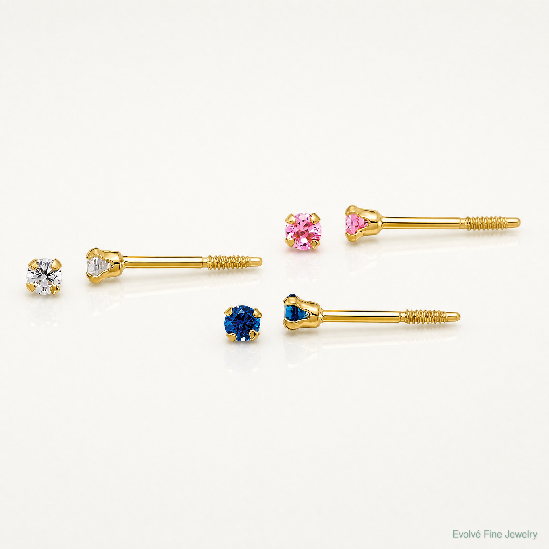 14k Polished 2mm White Pink And Blue CZ Screwback Set of 3 Earrings - Lifestyle View